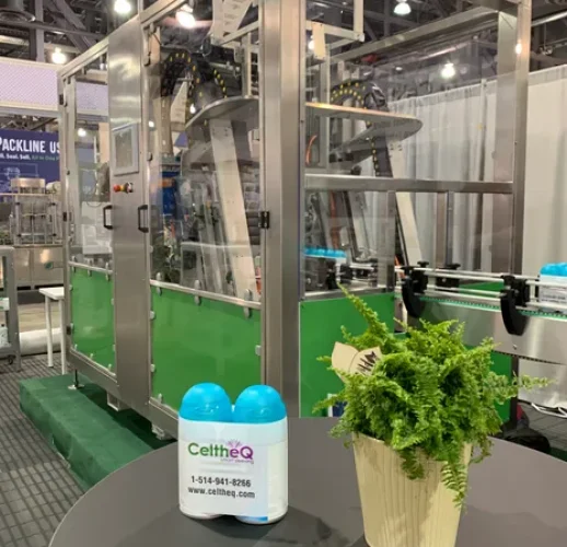 CeltheQ sleeve applicator applying labels to bottles on production line